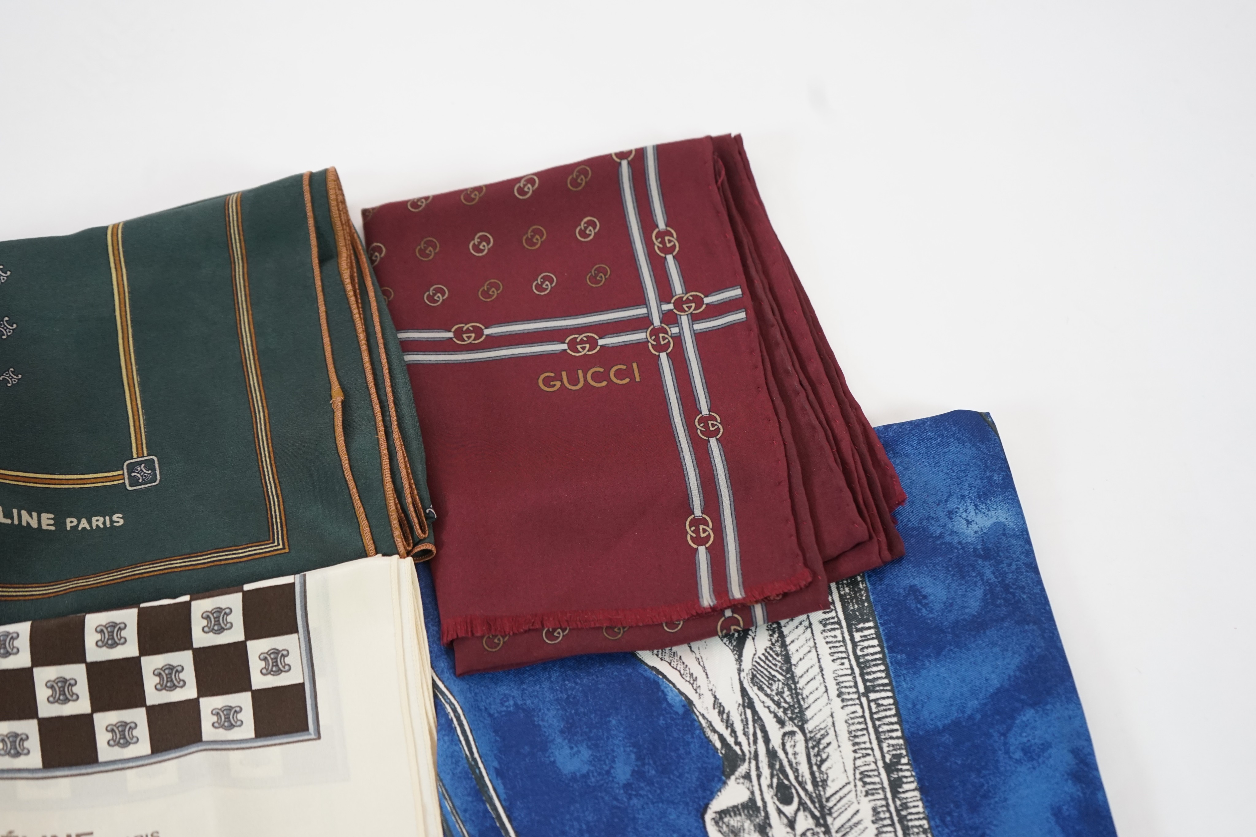 Three Gucci silk scarves, two by Celine and one by Balenciaga